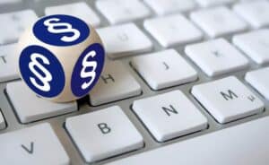 corma- A blue and white ball sits on top of a keyboard.